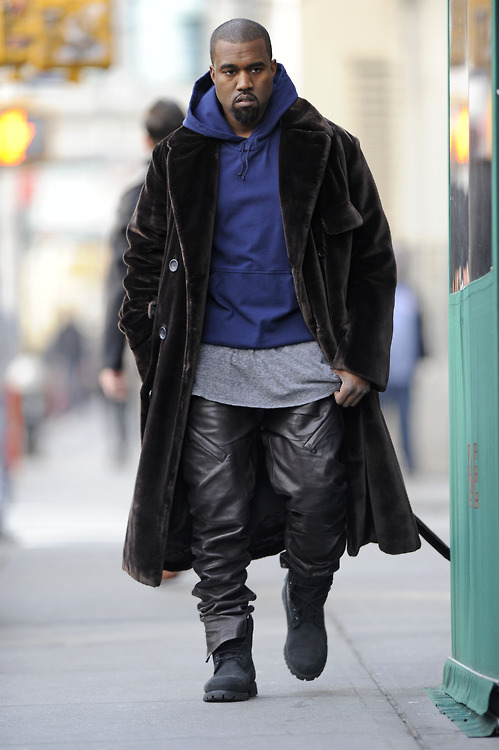 Kanye West walks and talks on his cellphone while out shopping in Soho, NYC