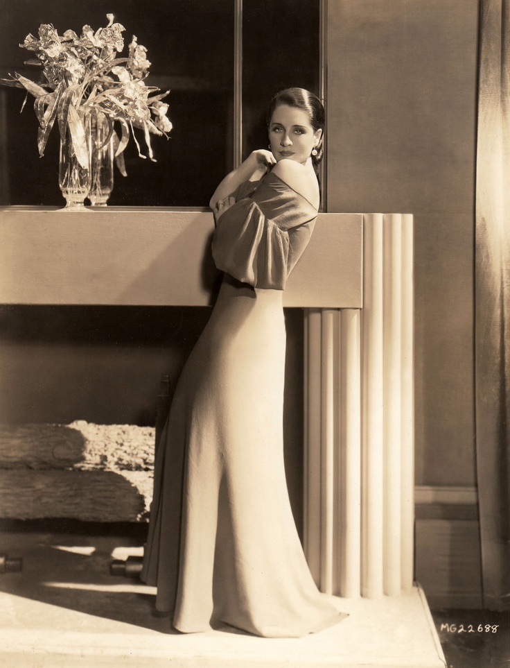 Norma Shearer in a gown by Adrian, 1934.Photo by George Hurrell.