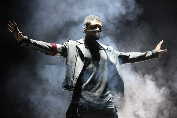 Usher in Maison Martin Margiela Chain Sneakers and Pyer Moss Custom Biker Jacket on Tour
