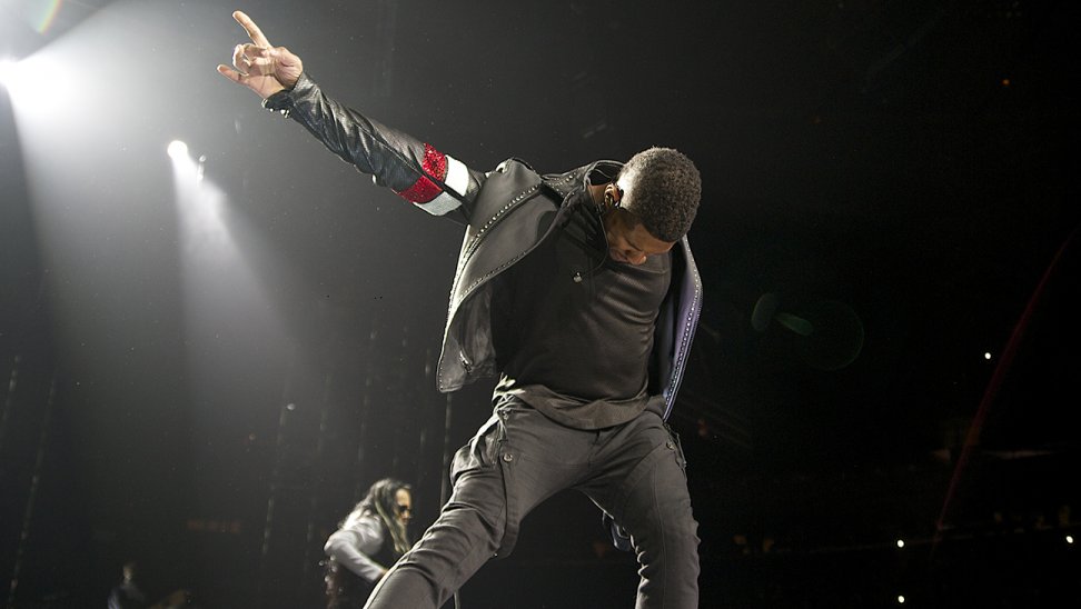 Usher in Maison Martin Margiela Chain Sneakers and Pyer Moss Custom Biker Jacket on Tour