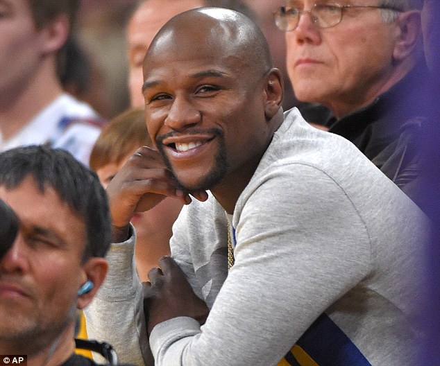 Floyd-Mayweather-sits-courtside-in-Alexander- Mcqueen