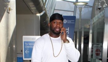 50Cent-wearing-Champion-Sweatpants-and-Air-Jordan-6-Retro-Carmine-Sneakers-Shoes-at-LAX