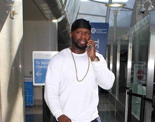 50Cent-wearing-Champion-Sweatpants-and-Air-Jordan-6-Retro-Carmine-Sneakers-Shoes-at-LAX