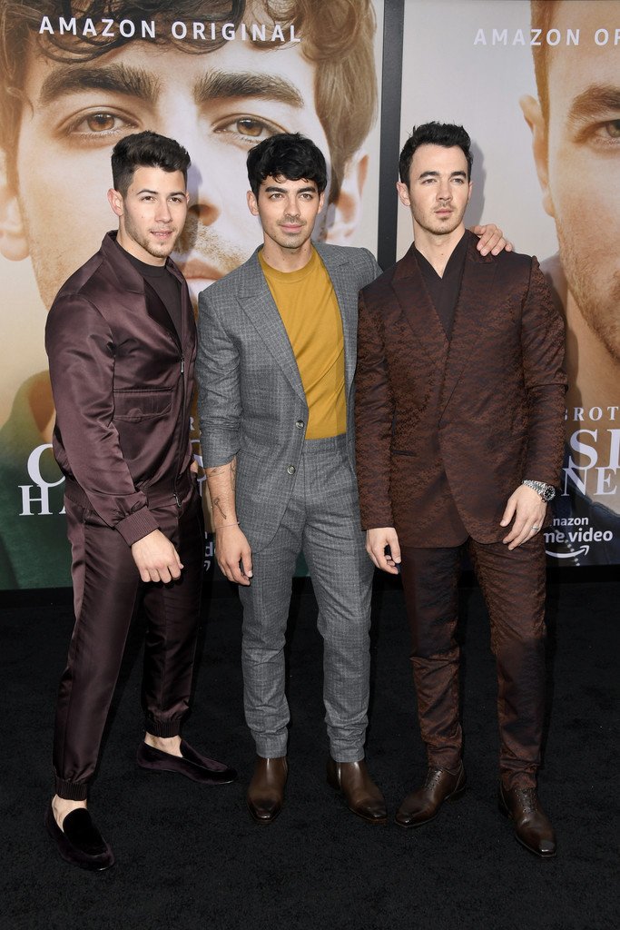 The Jonas Brothers In  Ermenegildo Zegna XXX @ “Chasing Happiness”  LA Documentary Premiere