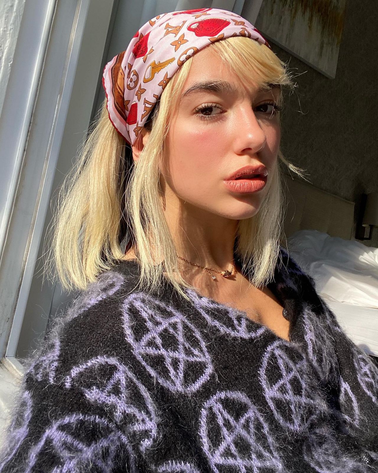 Dua Lipa In Ashley Williams Sweater & Louis Vuitton Headscarf – Instagram