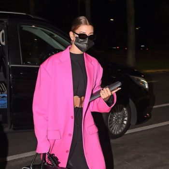 hailey-bieber-in-pink-balenciaga-coat-arriving-the-airport-in-milan-italy