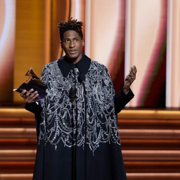 jon-batiste-accepting-his-album-of-the-year-award-for-we-are-in-alexander-mcqueen-2022-grammys