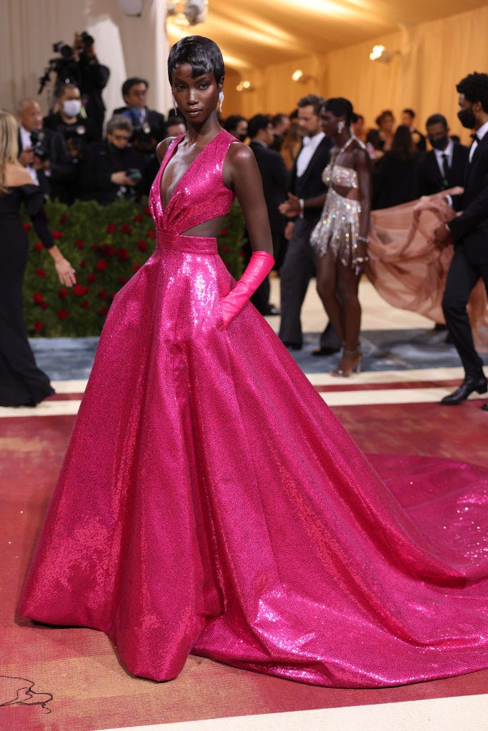 anok-yai-wore-a-hot-pink-sequined-custom-michael-kors-gown-the-2022-met-gala
