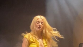 lorde-wears-yellow-dress-while-performing-solar-power-tour-concert-in-london