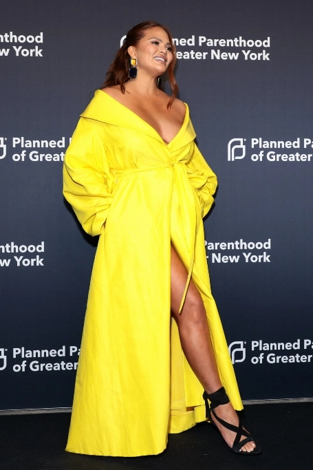 Chrissy Teigen  wore    Monique L’huillier Coat @ Planned Parenthood’s New York Spring Benefit Gala, 2023