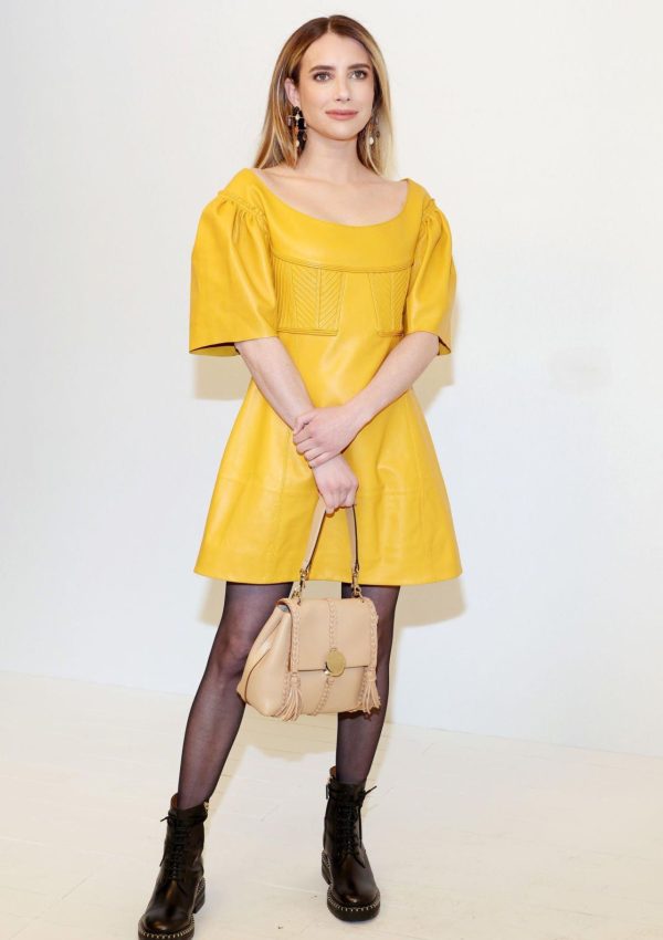 Emma Roberts in Yellow Leather Dress With Combat Boots @ Chloe Fall 2023  Paris Fashion Week  Show