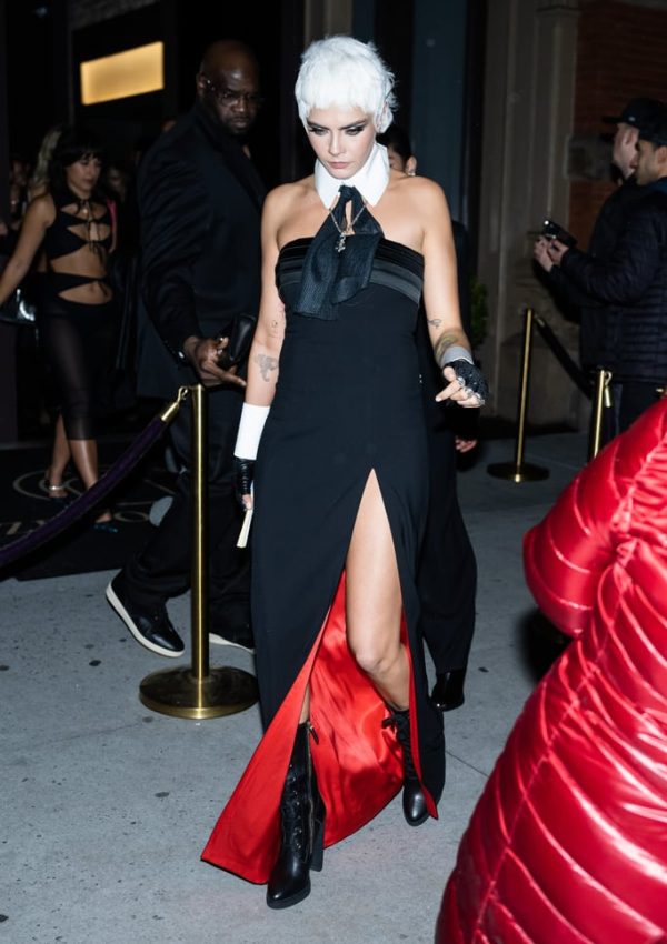 Cara Delevingne  in black dress with thigh-high slit  @ Met Gala party 2023